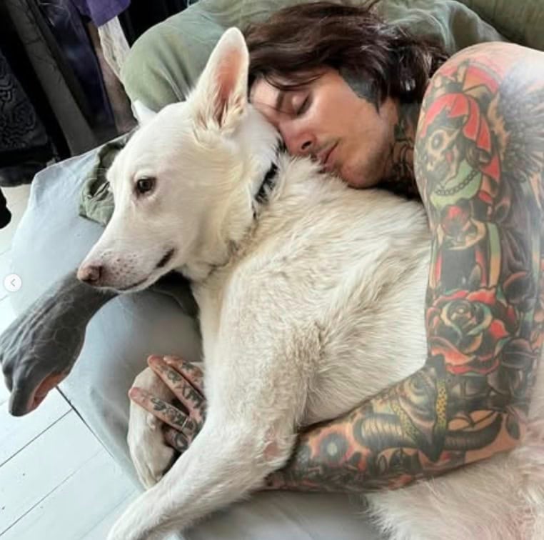 Oli Sykes cuddles with his late dog Luna