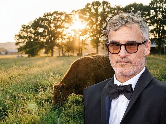 Joaquin Phoenix at a farm sanctuary meadow