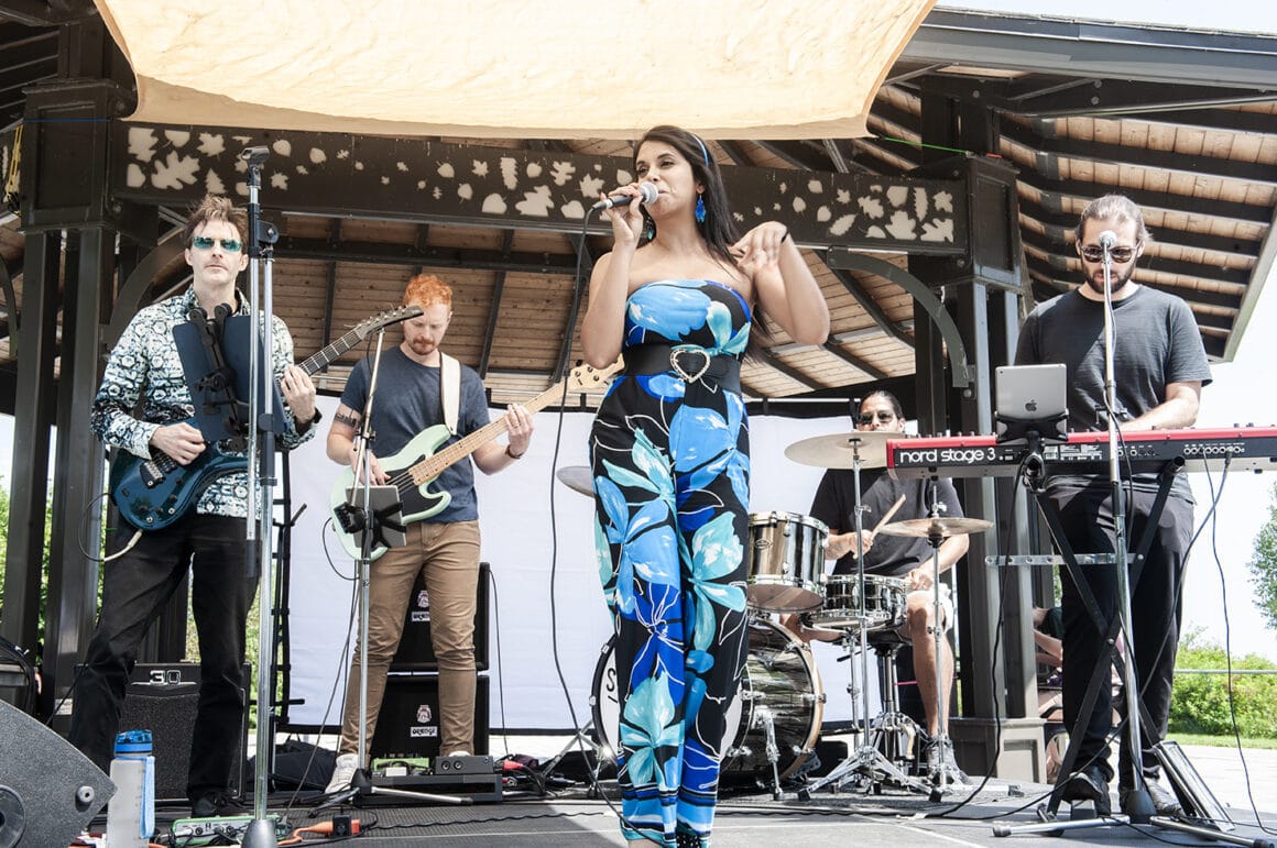 Band plays live on the bandshell stage at Burlington VegFest in Spencer Smith Park, Ontario