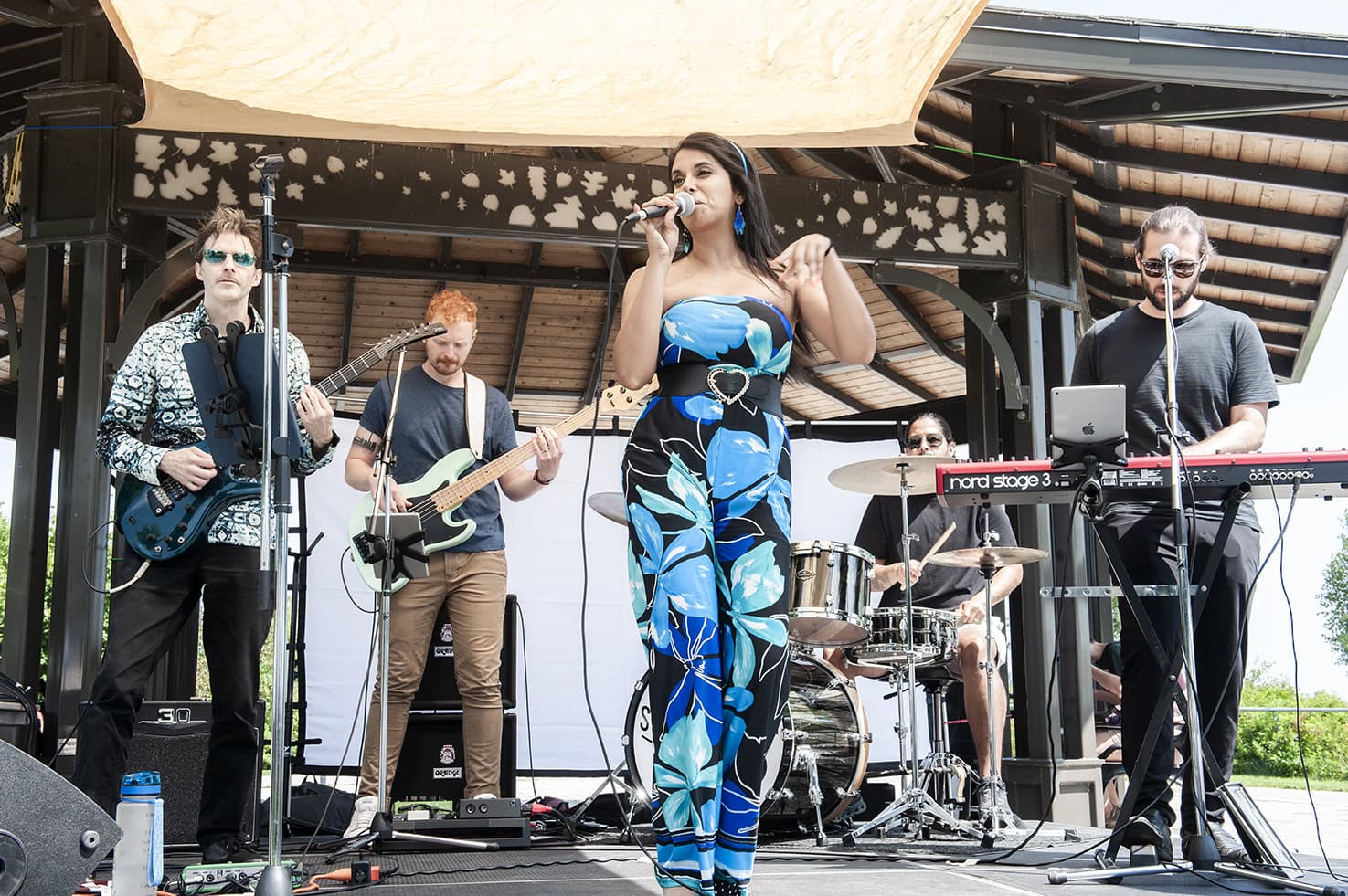 Band plays live on the bandshell stage at Burlington VegFest in Spencer Smith Park, Ontario