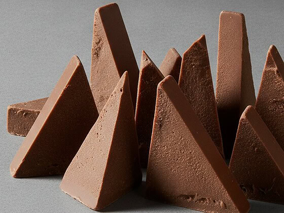 A triangular bar of chocolate broken into peaks