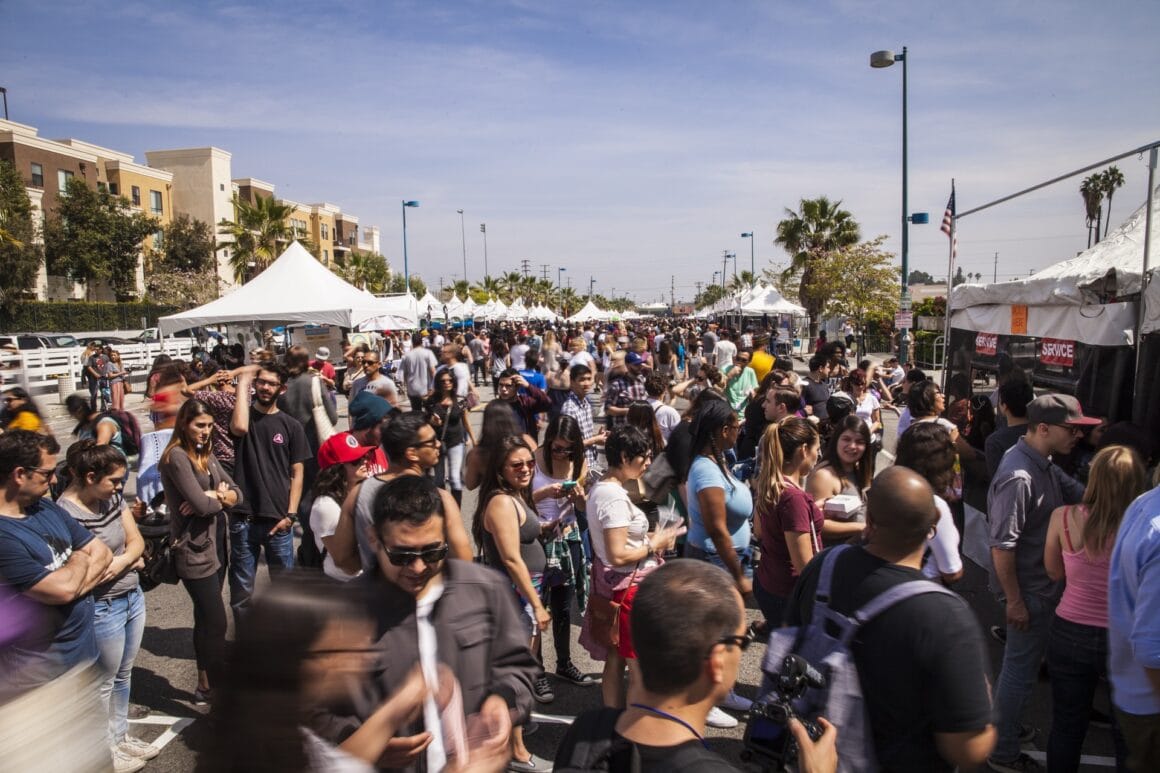 Crowds between food stalls at the Vegan Street Fair street festival in Los Angeles
