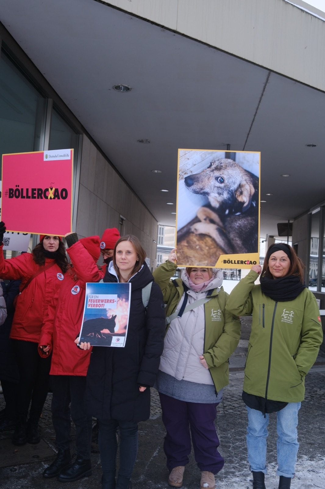 Team of Welttierschutzgesellschaft holding signs at an action in Berlin