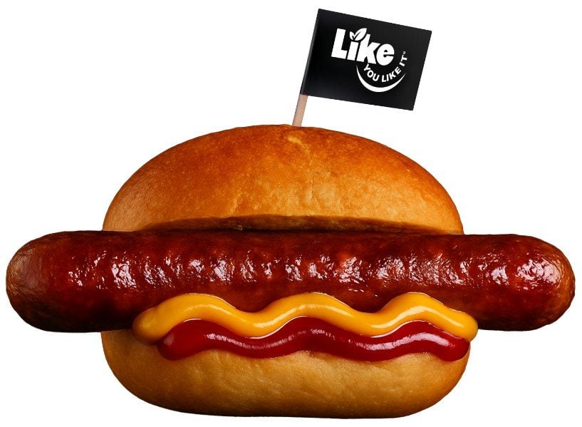 Vegane Like Bratwurst im Brötchen mit Senf und Ketchup und einem LIKE-Fähnchen