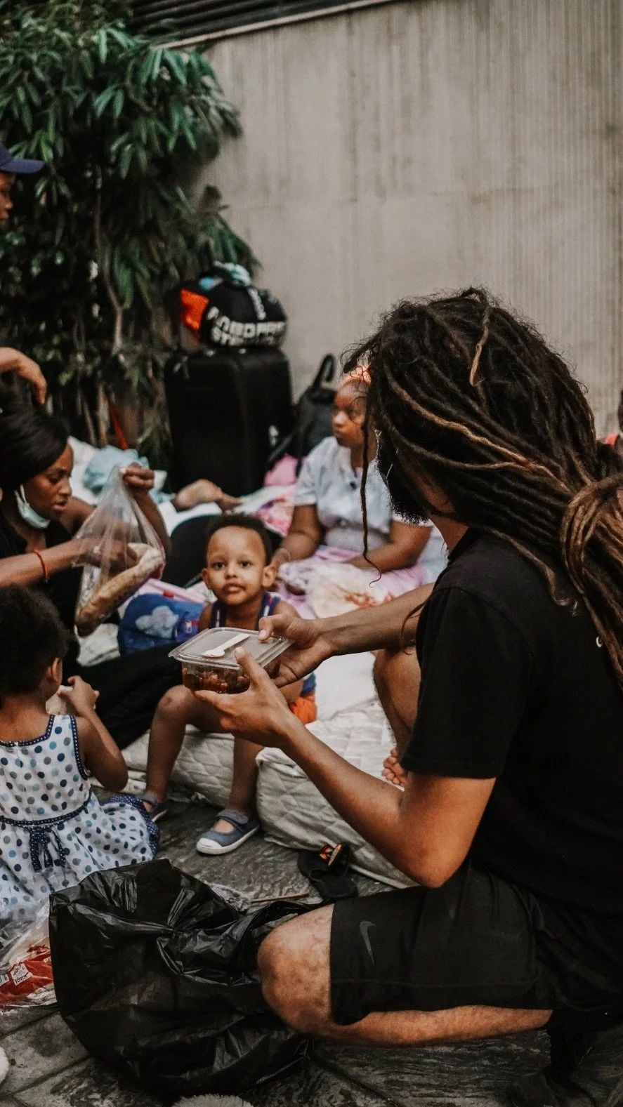 Seb Alex with a family and children during the Beirut food relief programme after the port explosion