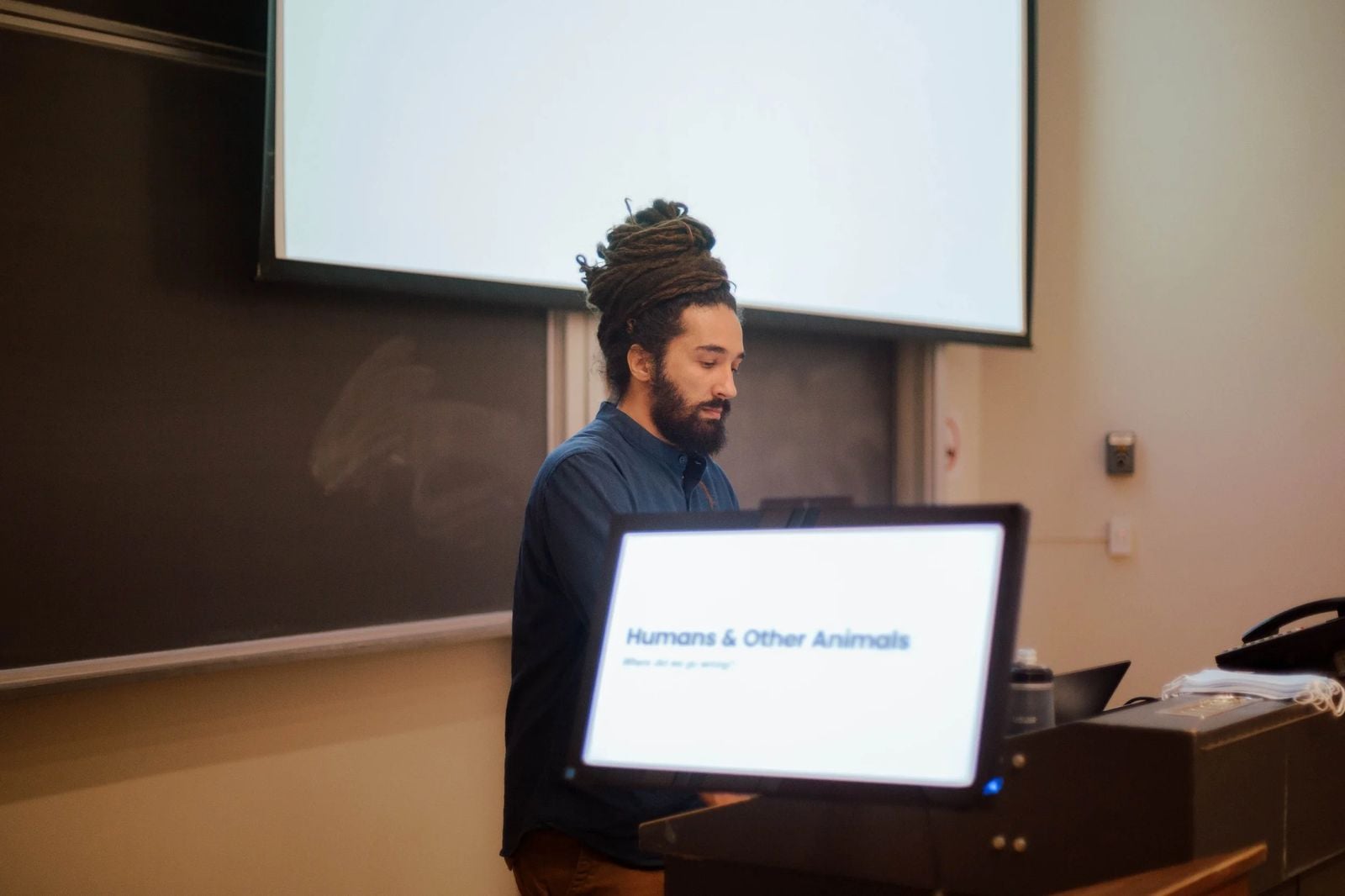 Seb Alex giving a lecture on animal rights in a university lecture hall