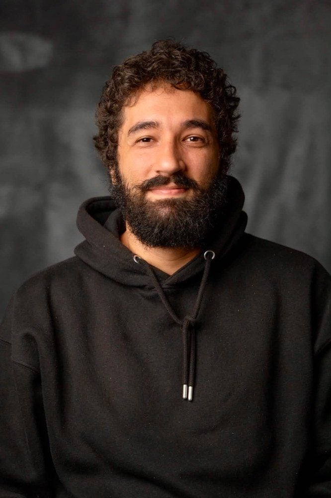 Portrait of Seb Alex, animal rights activist from Lebanon, in a black hoodie