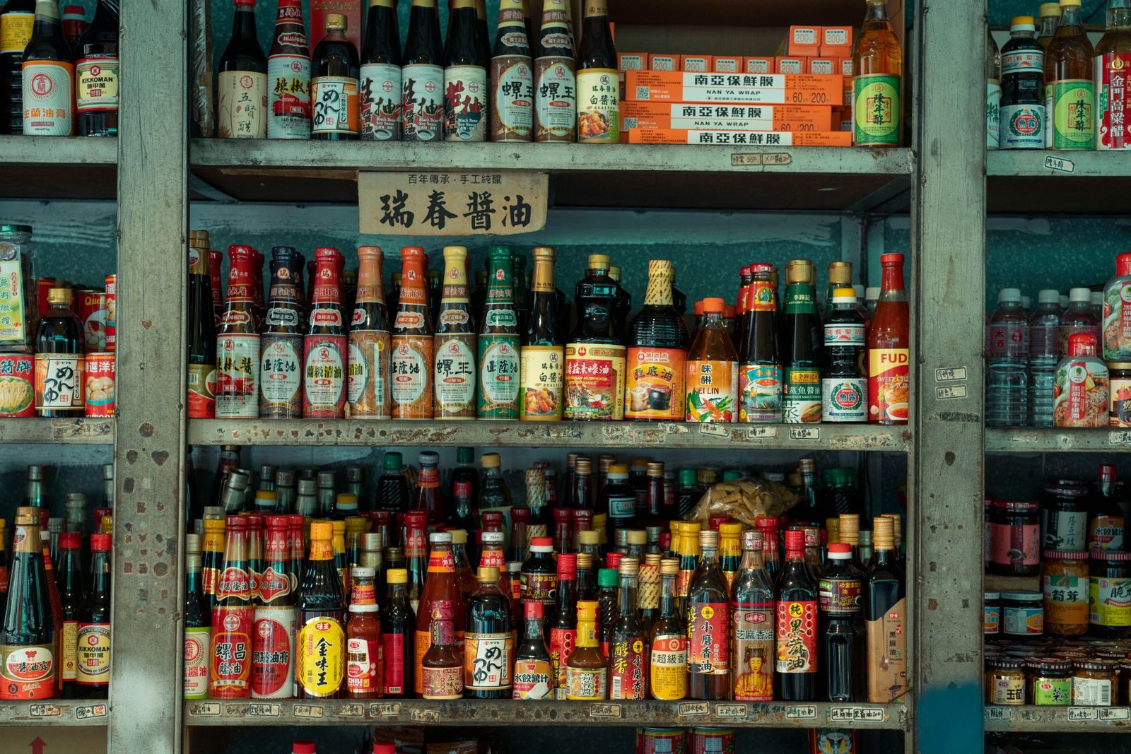 Shelves full of Asian sauce bottles in a shop in New Taipei City